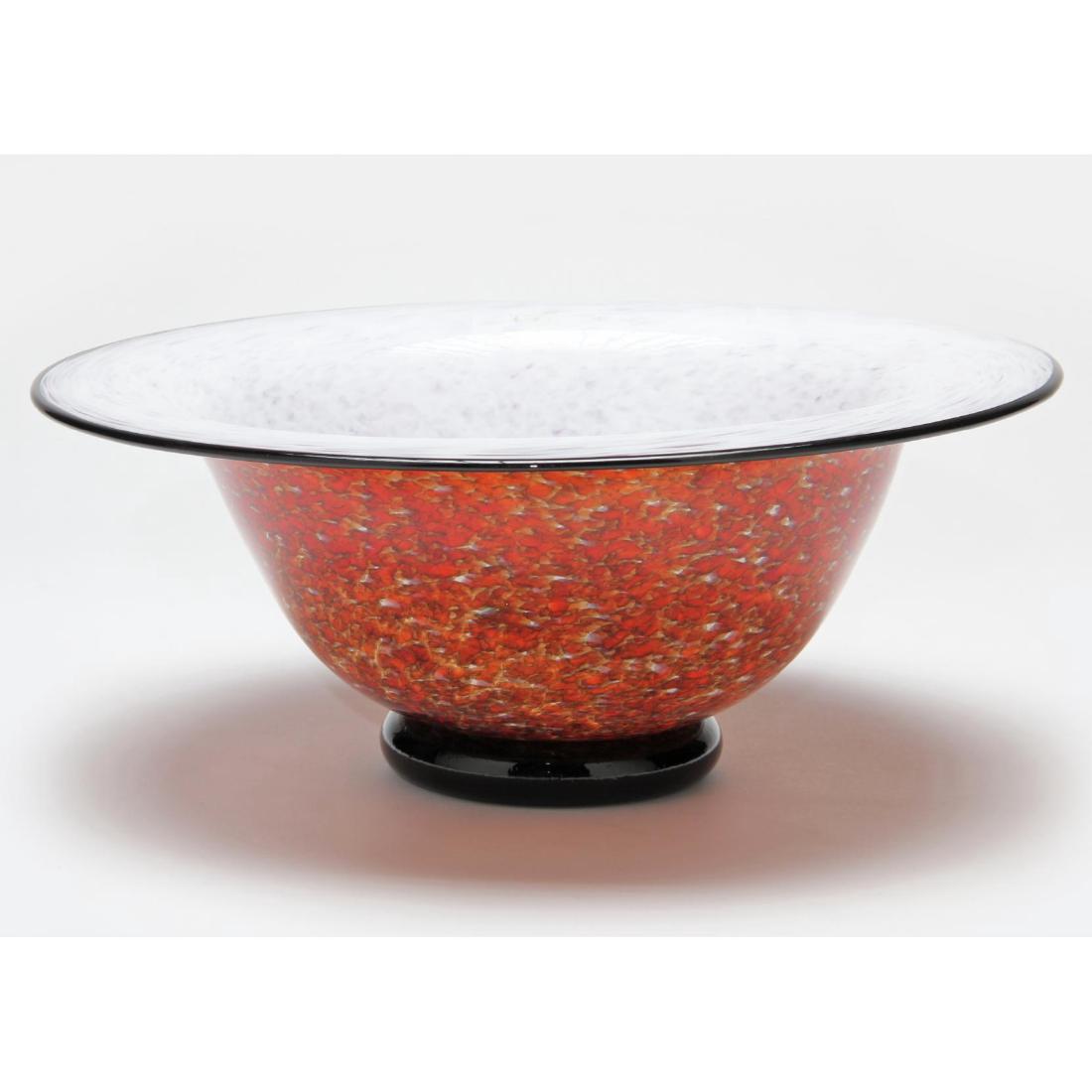 Brian Becher, Art Glass Pedestal Bowl: contemporary, flared black rim bowl with white over speckled orange/red with applied black foot, signed. 4.75 x 11.75 in. diameter. Brian studied and practiced at Corning and Penland to name a few. A
