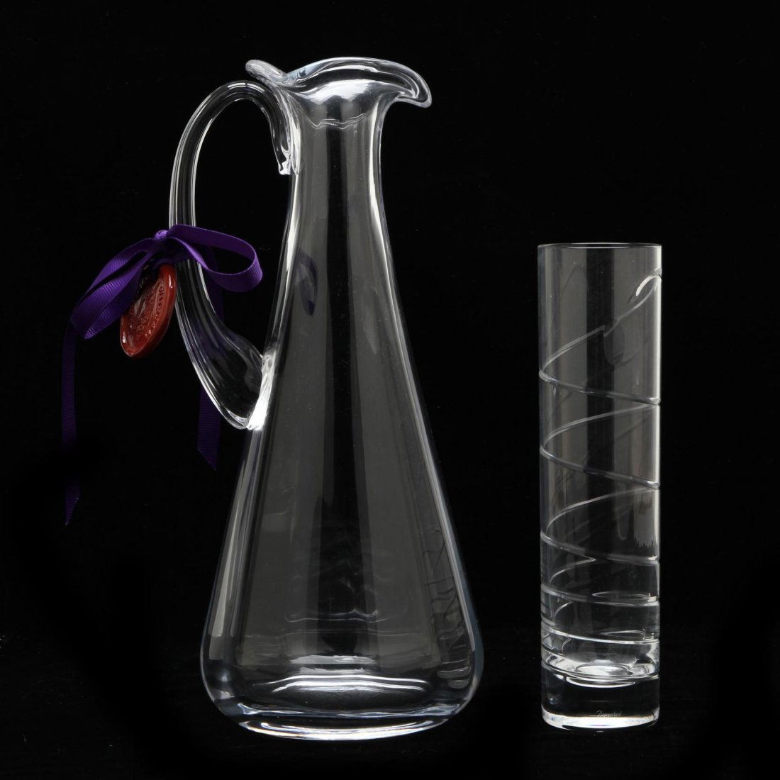 Fine Crystal Pitcher and Vase: including a William Yeoward "Margot" wine decanter with accompanying label; together with a Baccarat swirl cut glass vase, signed. Taller 11 in. From the Collection of Dr. & Mrs. Richard Epes Sold at