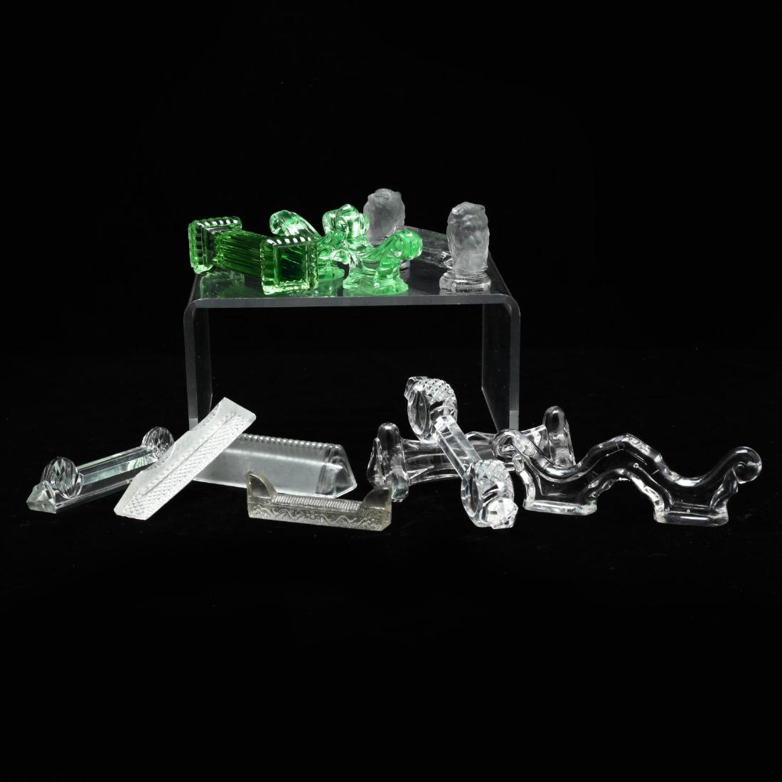 Ten Antique Individual Knife Rests: most are Art Deco, one features frosted glass lion heads. 2 5/8-4.25 in.