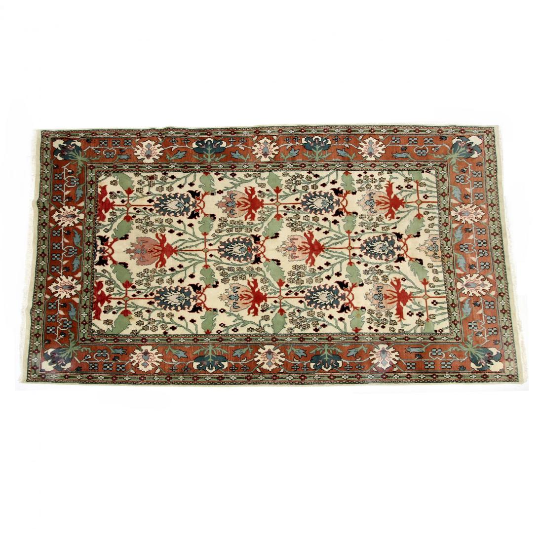 Arts and Crafts Style Carpet: handwoven, the ivory field with green, blue, and rust floral and vine motifs within wide rust major border with repeating design elements. 9 ft. 6 in. x 13 ft. 6 in.
