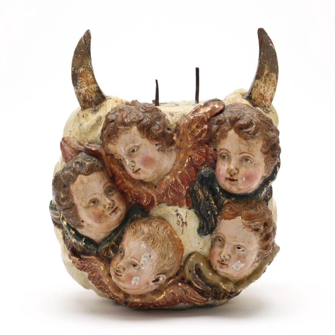 An Antique Gilt and Polychrome Decorated Sculptural: 19th century, likely Spanish, originally served as the base for a statue of the Madonna, the front featuring five carved heads of putti and the verso with clouds, faint illegible inscription in old sc