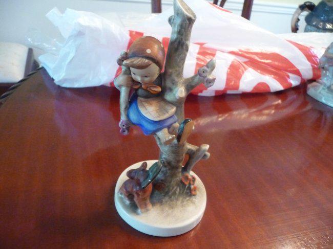 ANTIQUE HUMMEL" OUT OF DANGER " FIGURINE: RARE EARLY HUMMEL ,FEATURING A YOUNG GIRL IN A DRESS UP A TREE WITH A PUPPY AND WITH A SHOE, AS SHOWN...MEASURING ABOUT 6 1/4 INCHES HIGH ...ACCODING TO TRADE MARK MADE BETWEEN 1960-1972