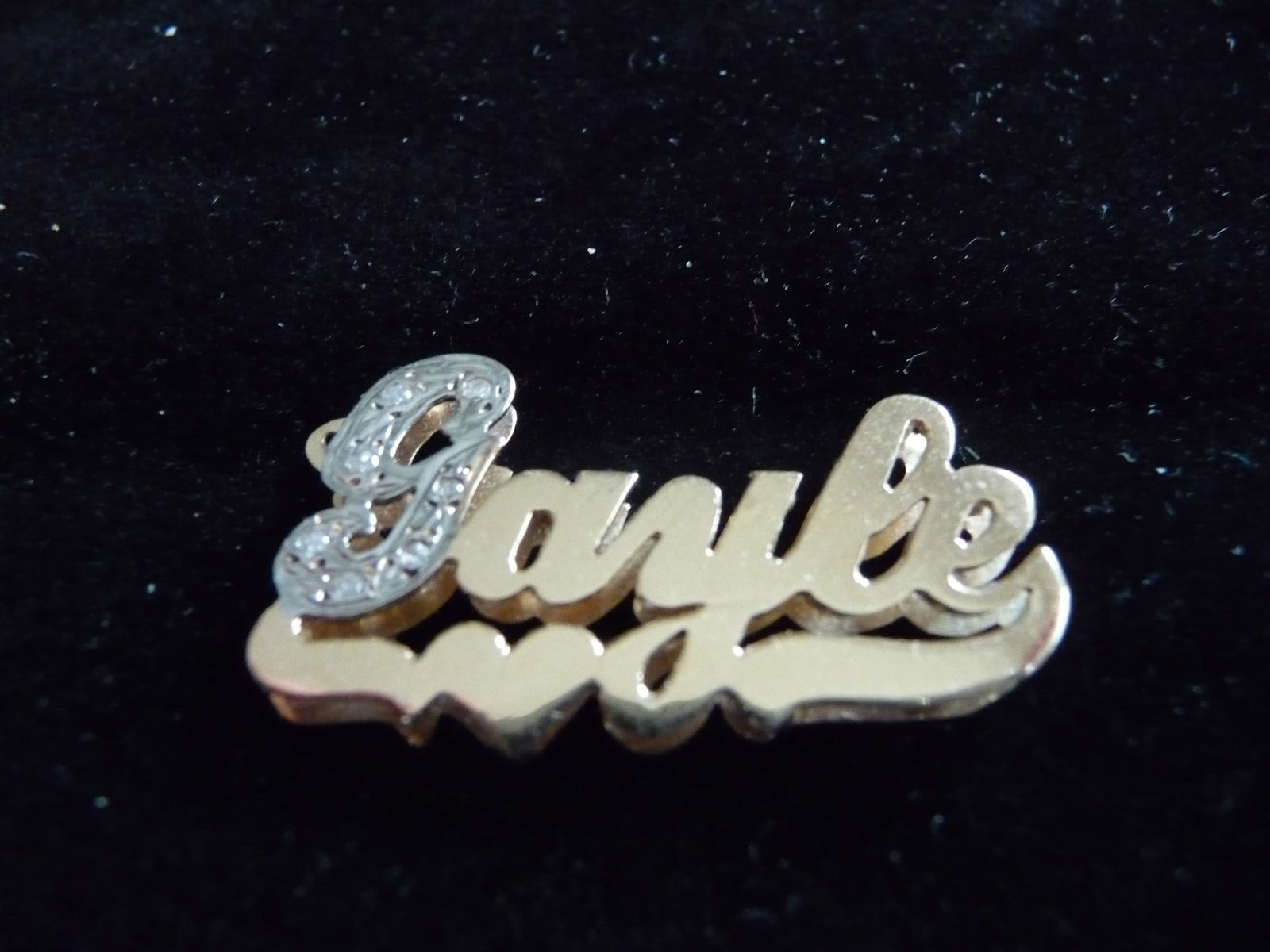 SOLID 14K GOLD WITH DIAMONDS " GAYLE " PENDANT: SOLID 14K GOLD WITH DIAMONDS AND A HEART PENDANT,AS SHOWN..MEASURING 1 1/4 INCHES LONG BY 5/8 INCHES