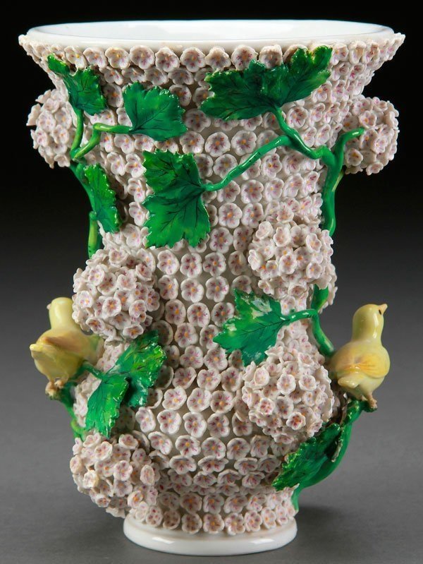 A MEISSEN SCHNEEBALLEN (SNOWBALL)PORCELAIN VASE, 19TH C: A Meissen porcelain vase,19th century, with applied flowers, leafy vines, and two birds. Crossed sword mark and incised number.7.75 inches (19.5 cm).Estimate $1500-$2000