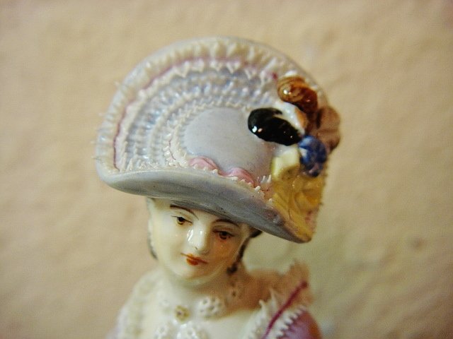 A Meissen figure of a lady playing cards, circa 1880