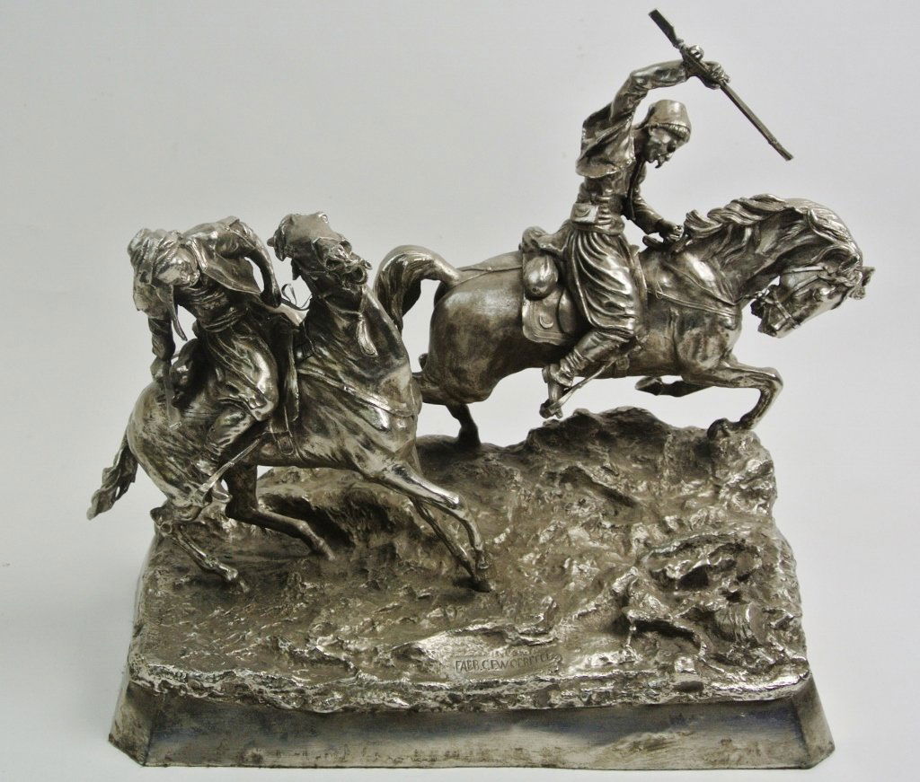 A FINE RUSSIAN BRONZE GROUP: A fine Russian bronze group of Kazak fighters, signed Grachev. measures 17.5" h, 19" long. Estimate $4.000-5.000