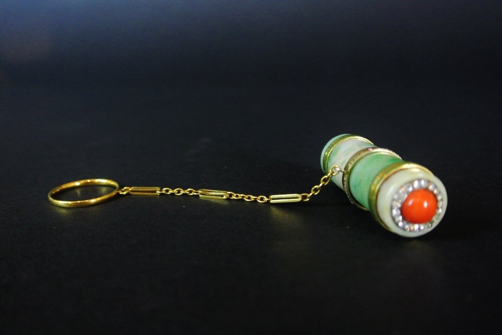 FABERGE GOLD , JADE,CORAL LIPSTICK W/DIAMONDS: A signed Faberge gold, jade lipstick holder, inset with diamonds , corral, fully hall marked in original box ,labeled Faberge.Estimate $7.000-10.000IT BEARS THE FABERGE MARK