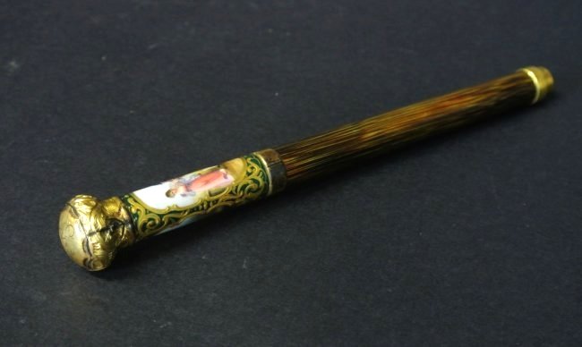 A GILT SILVER AND SEVRES PORCELAIN CANE HANDEL: A very fine gilt silver and Sevres porcelain walking cane handle , measures 8" long . .Estimate $400-500