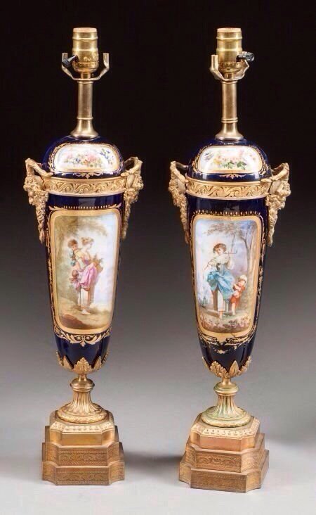 PAIR OF ORMOLU MOUNTED SEVRES PORCELAIN LAMPS: A pair of 19th century gilt bronze mounted Sevres porcelain lamps , measuring 24" high .Estimate $1.500-2.000