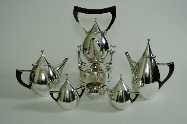 ART DECO STERLING SILVER TEA SET: A magnificent Sterling Silver six piece tea set , marked Sterling , 156 ozs total weight .Estimate $ 3.000-4.000