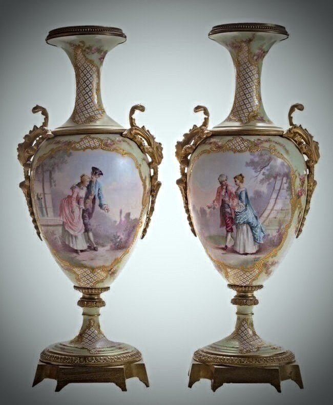 PAIR OF 19TH CENTURY ORMOLU MOUNTED SEVRES VASES: A fine pair of 19th century Sevres porcelain ormolu mounted vases, measures 18.25" high . .Estimate $1.500-2.000