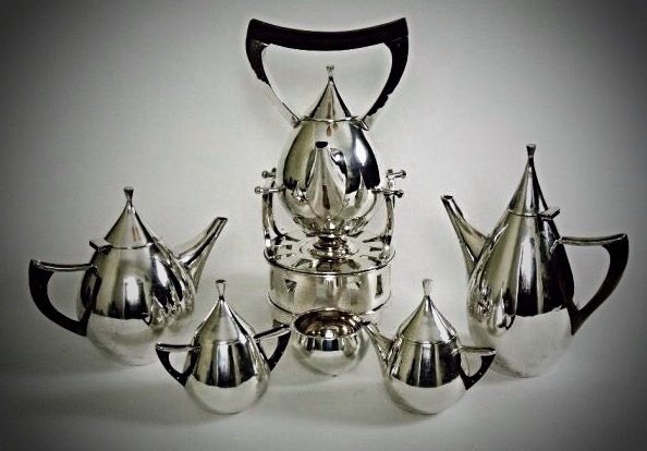 ART DECO MEXICAN STERLING SILVER TEA SET: A magnificent Mexican Sterling Silver six piece tea set , marked Sterling , 156 ozs total weight .Estimate $3.000-3.500