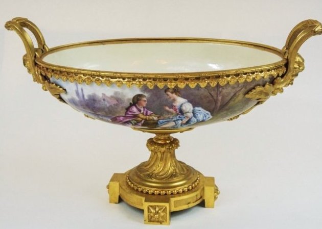 19TH CENTURY ORMOLU MOUNTED SEVRES CENTERPIECE: A magnificent 19th century dore bronze and Sevres porcelain centerpiece , 18" L , 11.5" high .Estimate $3.000-4.000