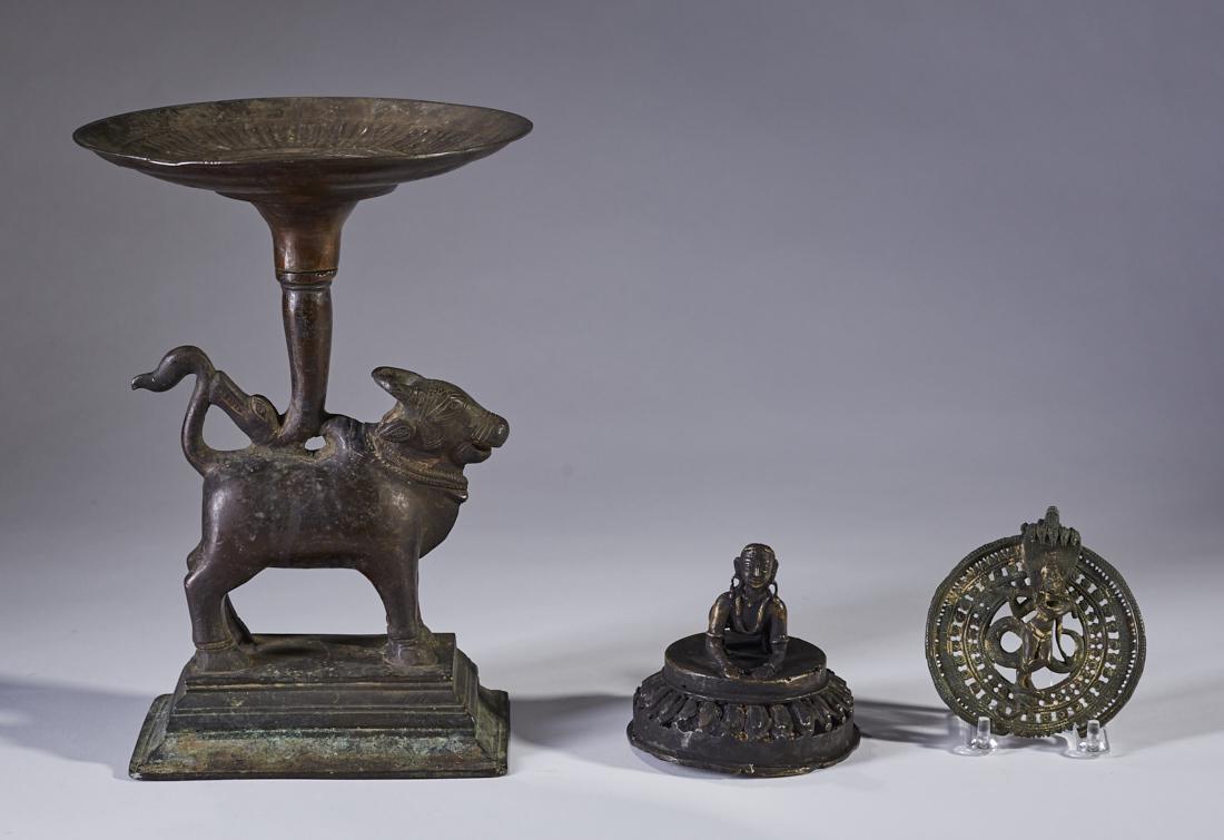 Group of Three Old India Brass Decorative Objects: Group of 3 old Indian brass decorative objects. The first is a lamp with a standing bull atop a stepped pedestal with a round tray top supported by a snake form. Measures 11.3 inches high. Next is a s