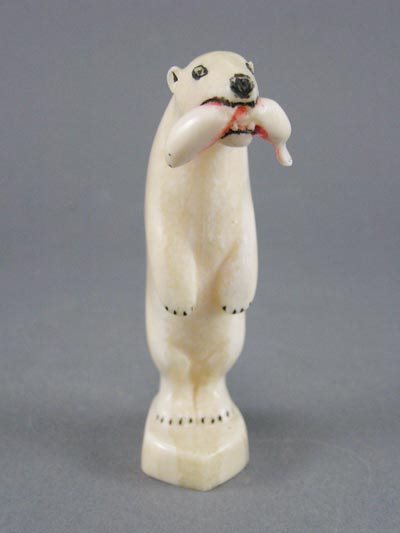Carved Eskimo Inuit Walrus Ivory Polar Bear: Carved Eskimo Inuit Walrus Ivory Polar Bear with Salmon. Bear standing with Salmon in its mouth. In good condition. 3 ½" h.
