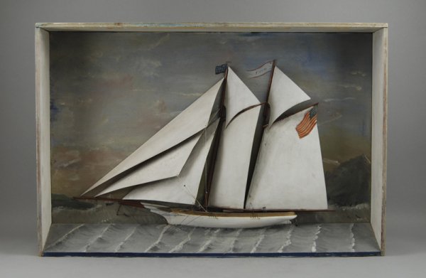 Carved Wood 19C Folk Art Diorama Clipper Ship -Foam: American Carved Wood Diorama of Clipper Ship "Eda". The folk art diorama has a small sailboat in the foreground and a three dimensional lighthouse in the background. The clipper ship is built of wood 