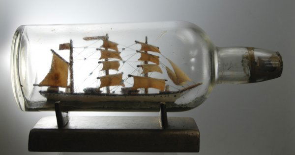 Old 19C Ship in a Bottle 3-Masted Nautical Marine: American 19C Ship in a Bottle of Three-Masted Sailing Ship "S. Maria". The old round whiskey bottle houses the ship that has a banner signed S. Maria. The ship bottle comes with the original gold pain