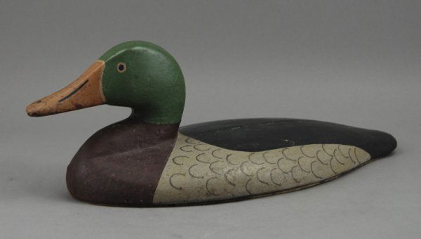 Old Cast Iron Sink Green Canvasback Duck Decoy: Cast Iron Sink Canvasback Duck Decoy with a green head. The sink decoy has good old repaint and measures 5 ½" high and 14" long and weighs 20 pounds.