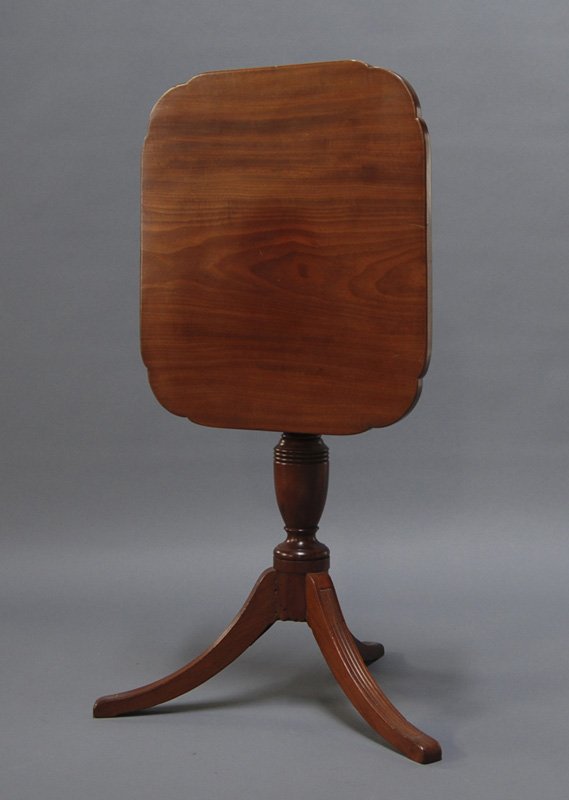 Federal 19C Tilt Top Mahogany Table w Reeded Legs: Federal 19C Mahogany Tilt Top Table. The Federal table has reeded feet and a shaped top in good condition. Measures 28" high and the top measures 22" x 20".