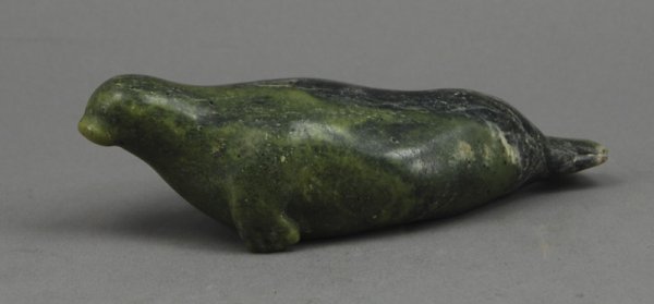 Inuit Eskimo Indian Green Soapstone Carving of Sea: Inuit Green Soapstone Carving of a Seal. Good condition. Measures 2 1/8" high and 6 1/2" long.