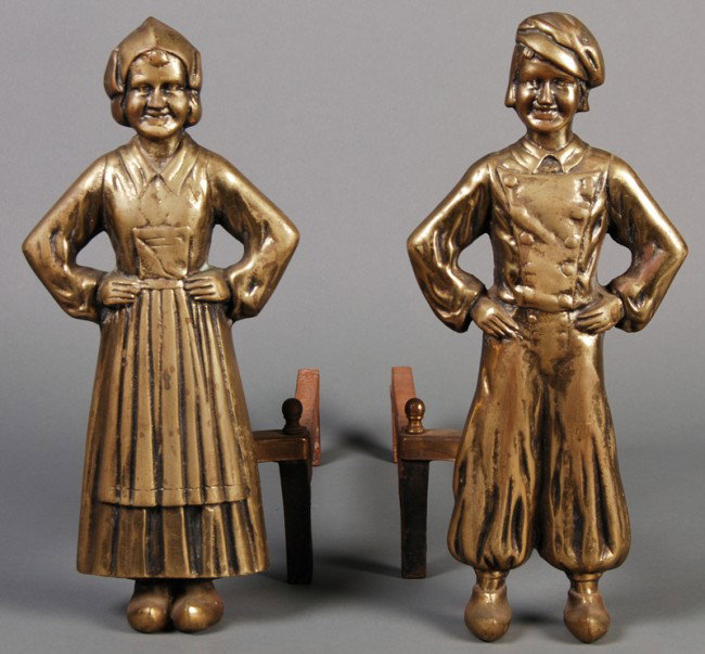 Brass of Figural Dutch Boy & Girl Andirons: A pair of Dutch boy and girl brass andirons, 20C, depict a boy and girl in traditional costume, in good condition. 16" high,7" wide.