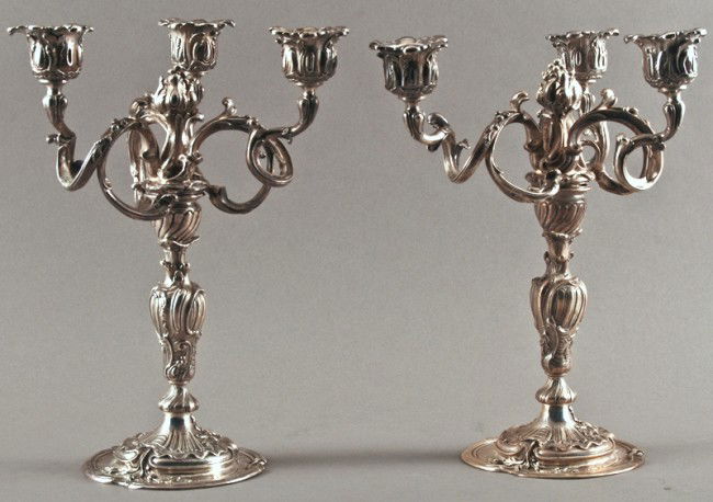 Pair Antique French Sterling Rococco Candlelabra: Pair of French Antique sterling 3-arm Roccoco candelabra are 2-part, can either be used as a single candle stick or a 3-arm candelabra. The French hallmark along the base in a rococo style. In good co