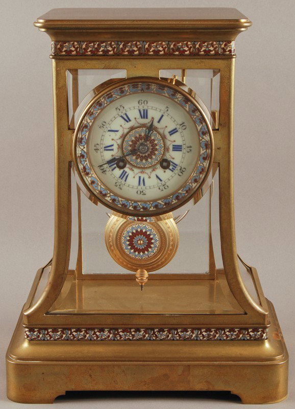 French Enameled Brass Crystal Regulator Clock: French Enameled Brass Crystal Regulator. Has the original striking movement in good shape and does run. Enameled pendulum as well as trim with sloped beveled glass design raised on a bracket base. Goo