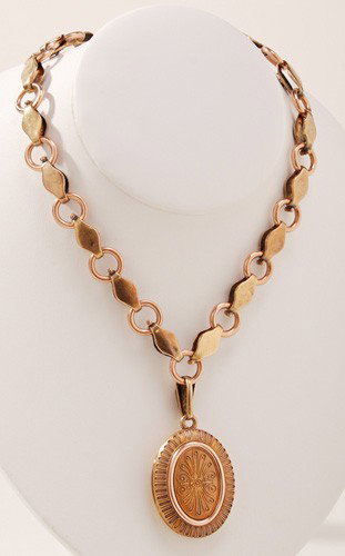 Edwardian Etruscan 14K Gold Oval Locket Necklace: Edwardian Etruscan 14K Gold Oval Locket Necklace is unmarked and assayed to be 14K and weighs 28 dwt.. The chain measures 18" long, the oval locket and hook measure 2" long. In good condition.