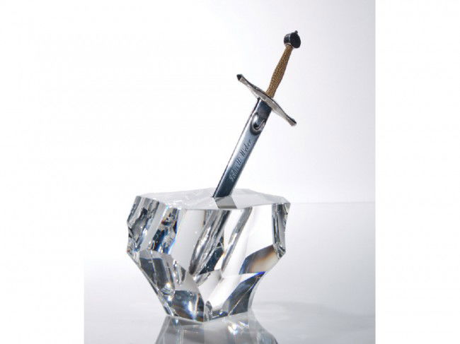 Steuben Glass Excalibur Sterling Silver Sculpture: Steuben "Excalibur" Art Glass Sculpture. Crystal art glass stone from the "Arthurian" legend has a sterling and 18 karat gold sword inscribed to John Webber 1971. Signed Steuben in script on the base.