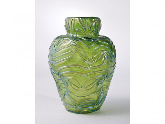 Austrian Loetz Formosa Iridescent Art Glass Vase: Loetz "Formosa" pinch formed vase has a green body with blue to green applied tendrils. The vase is in good condition with one small pencil-point chip on the very bottom of the vase. Measures 6" high