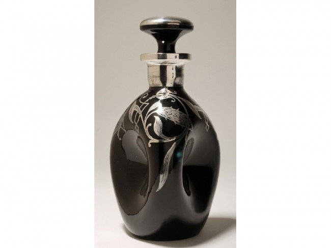Art Deco Sterling Silver Overlay Pinch Decanter: Art Deco black glass sterling overlay Pinch bottle. The decorative floral design bottle - decanter is signed sterling on the overlay. In good condition. Measures 9" high x 4 ¾" wide.