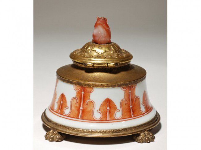Art Deco - Nicholas Haydon N.Y. Carnelian Inkwell: Nicholas Haydon ink well has a hand painted porcelain, Asian inspired body with embossed hinged lid, topped with an animal figure that has a chip on one ear. The bronze mounts are in good condition wi