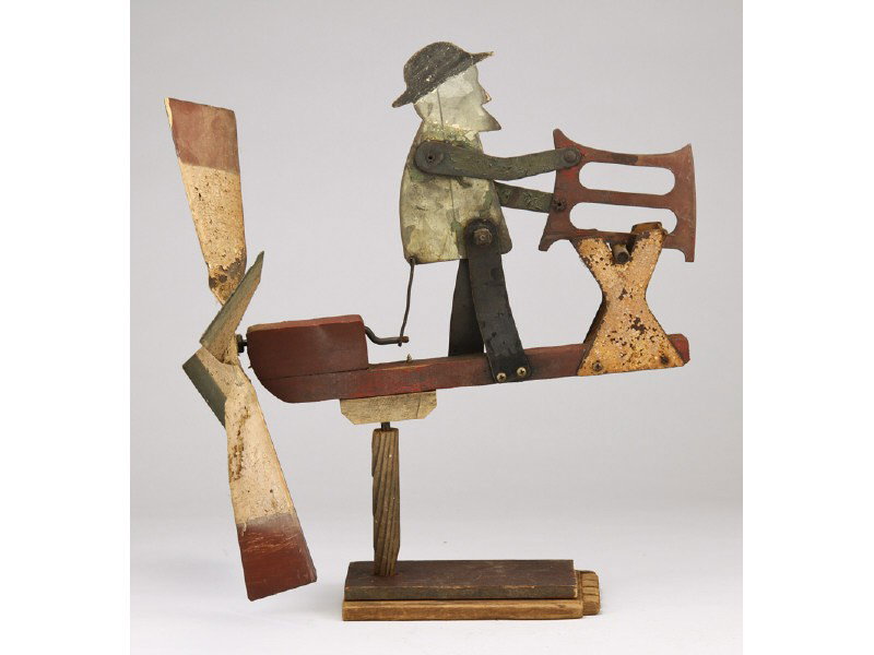 Old Painted Tin Man Sawing Whirligig N. Carolina: Old 19th Century Painted Tin Folk Art Whirligig. Depicts man with a hat and bucksaw. In good working condition. Still retains most of original paint and has some surface rust. Man is mounted on a hand