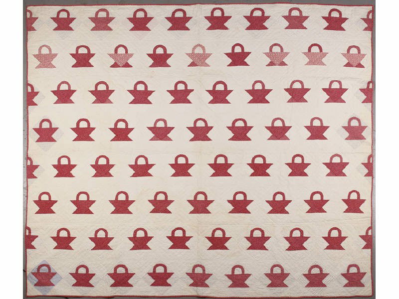 Antique Red &White 19th Century Calico Basket Quilt: Turkey Red and White 19th Century Calico Basket Quilt. The hand made graphic basket pattern quilt is in good condition. There is some slight wear and binding loss on one border. Measures 73" long x 78