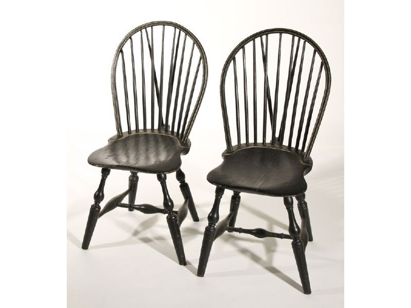 Pair Black 19C Braced Bow Back Windsor Side Chairs: Pair of 19th Century Braced Bow Back Windsor Side Chairs. The pair of chairs have an overcoat of black paint and shaped saddle seats. They are in good condition. Measures 37" high, 18 ½" wide and a s