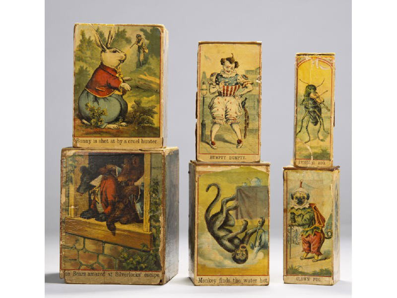 Set of Six Lithographed Stacking Wooden Blocks Toy: Set of Six Lithographed Stacking Wooden Blocks. Early toy set that has loss and wear on many of the blocks, as can be seen in the photos. Most likely McLaughlin. Largest block measures 6” high, the 