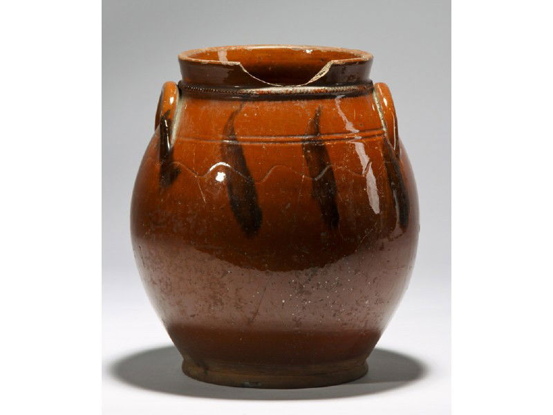 Redware 19C Ovoid Crock Applied Rope Neck: Decorated Glaze 19C Redware Ovoid Crock. Crock has an applied rope neck and incised lines. The crock unfortunately has a 2 ¾" x ¾" missing piece on the top rim and continues to a tight hairline crac