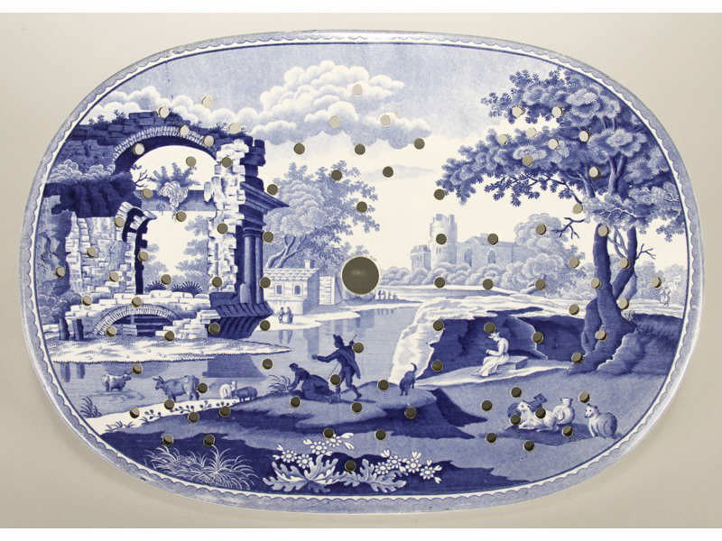 Blue 19C Transfer Castle Scene Spode Meat Drainer: English Spode 19th Century Blue Transferware Castle Scene Meat Drainer. The dark blue transfer decorated porcelain meat drain has a scene of ruins in a pastoral setting. Impressed Spode. It has some m