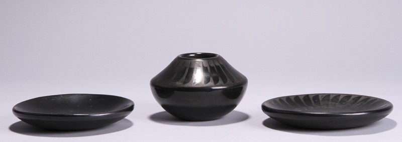 San Ildefonso- Native American Indian Pottery (3): Group of 3 of San Ildefonso Native American Indian Pottery. One 3" x 4 ½" Pauline vase and two 6" in diameter plates one signed Santana Adam. The other is signed "Maria Poveka". In good condition. Al