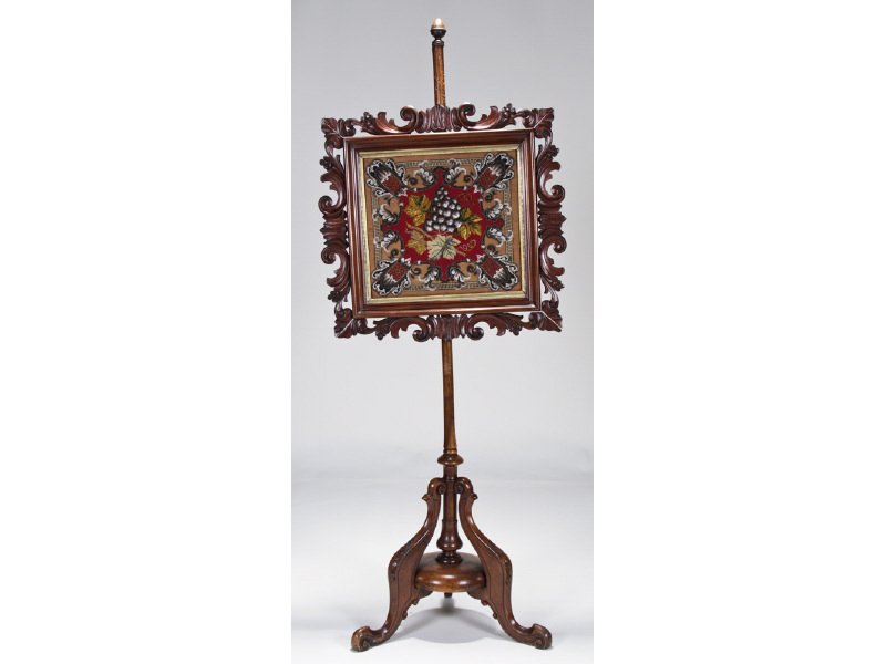 Edwardian 19C Mahogany Carved Beadwork Firescreen: Edwardian Mahogany Carved Bead Work Fire Screen. The adjustable mid-19th century Edwardian fire screen is raised on a carved tripod base. It has a carved framed beadwork adjustable screen. In good ove
