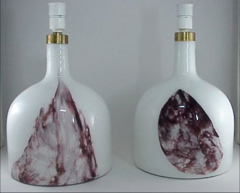 Pair HOLMEGAARD Art Glass 1950s Lamp s: Pair of HOLMEGAARD Art Glass 1950s Lamps. These two white glass lamps have abstract amethyst swath of glass on the front. Paper label affixed to bottom reads: Holmegaard Type Lamp Art Symmetrisk. Fine
