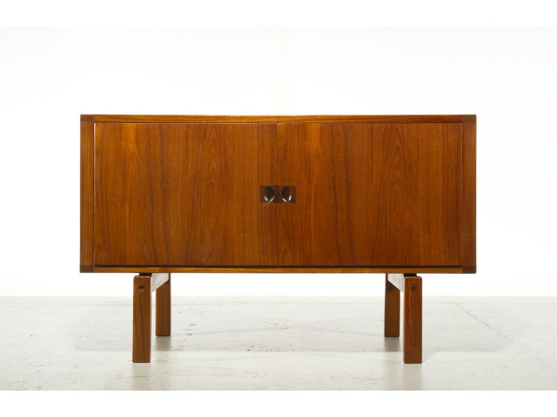 Petite Swedish Teak Credenza: Petite Swedish Teak Cabinet with 2 Doors and adjustable shelves. Unique Rosewood pulls on doors. Fully finished Teak back. Good condition. Marked Sweden on underside of cabinet. Measures 27.5“H x 43