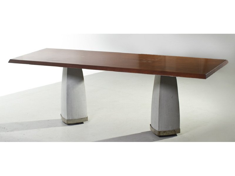 Industrial Double Pedestal Concrete Dining Table: Industrial Mahogany Conference Table Double Concrete Pedestals. In good condition with wear from normal use. The two shaped concrete pedestals have steel straps. The bases have wheels underneath and r