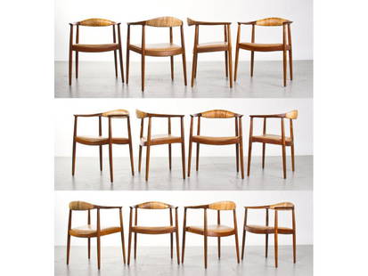 Set of 12 Danish Modern Hans Wegner Round Chairs: Set of 12 Hans Wegner Round Chairs c.1949. Also known as "The Chair". These examples were purchased circa 1955 for the Manufacturers Trust Building in New York City. Walnut, Cane, Leather Upholstery.