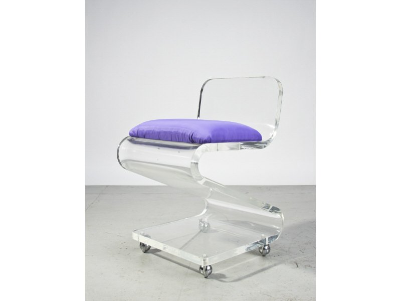 Mid Century Modern Bent Lucite Vanity Chair: Mid Century Modern Bent Lucite Vanity or Occasional Chair. The circa 1965 heavy lucite high quality chair is on chrome casters. Good condition. Measures 26"H x 16"W x 18"D