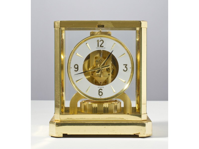 Jaeger Le Coultre Atmos Clock: Jaeger Le Coultre Atmos Clock. In good condition with some inconsistencies in the patina (needs polishing). The clock is not running at this time. Measures 9" high x 8 1/2" long and 5 3/4" deep.
