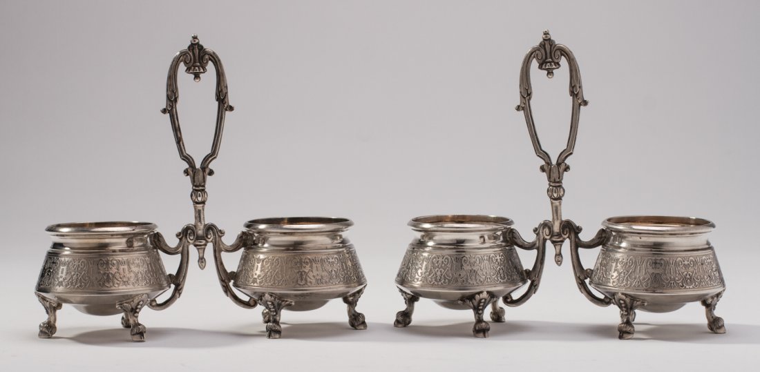Pair of French Sterling Silver Double Salt Cellars: Pair of 19C French Sterling Open Handled Double Salts. The ornately engraved 19th century salt cellar dips have finely cast handles and rest on figural animal cloven hooves. Fine period monogram “DL