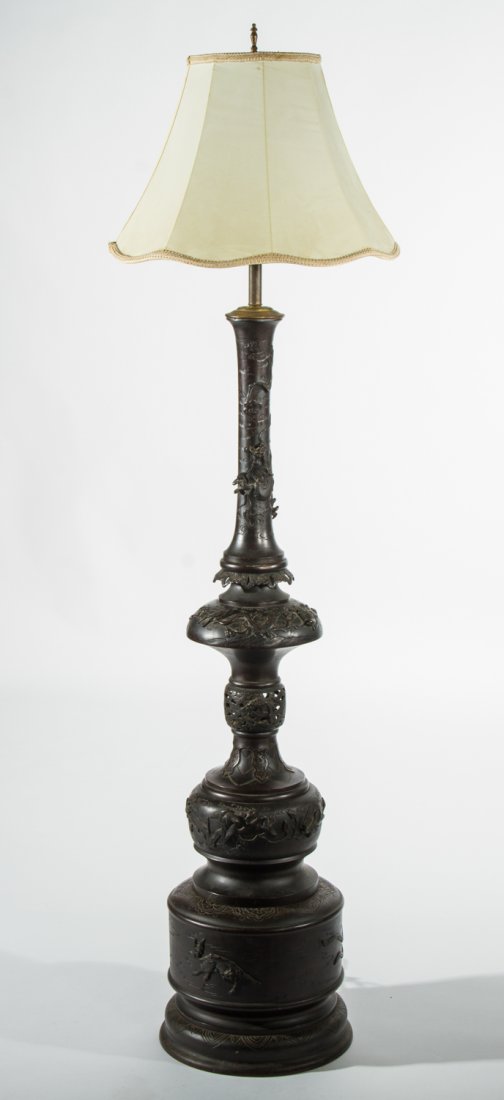 Japanese 3-Section Bronze Floral 63" Floor Lamp: Japanese Three Section Bronze Floor Lamp. The 1920's or earlier bronze figural lamp is decorated with birds and flowers in high releif on the body. The bottom section is decorated with embossed animal
