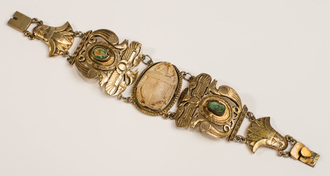 Egyptian Coin Silver Scarab and Turquoise Bracelet: Egyptian Coin Silver Scarab and Turquoise Bracelet. The Art Deco bracelet from the 1920s has a terra cotta scarab in the center, which has a chip on the nose. Set with two rough cut turquoise. The sil
