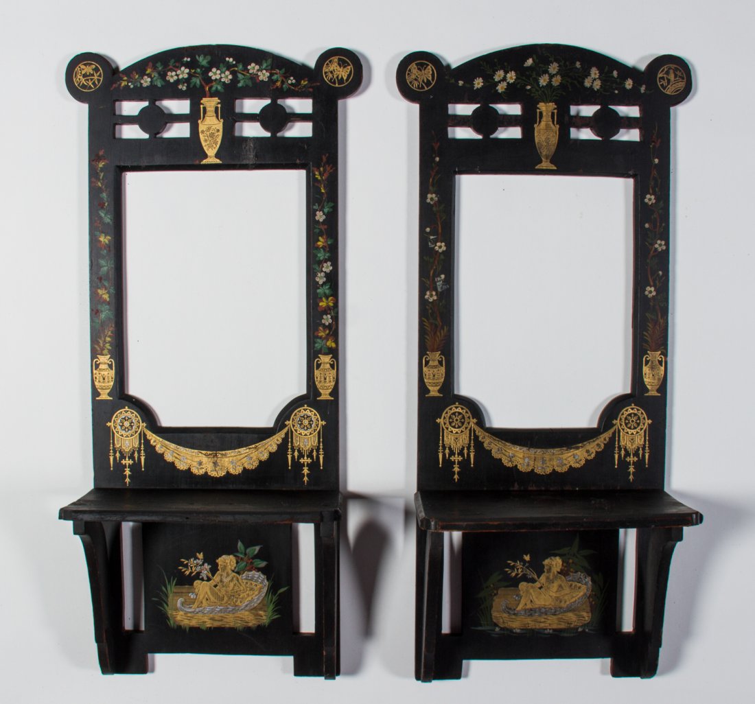 Pair of Edwardian Ebonized Gilt Aesthetic Wall Shelves: Pair of Edwardian Ebonized Hand-Painted Gilt Open Wall Shelves. The decorative Aesthetic Movement ebonized shelves have silver and gold gilt stencils of a woman and a shell form boat at the bottom. St